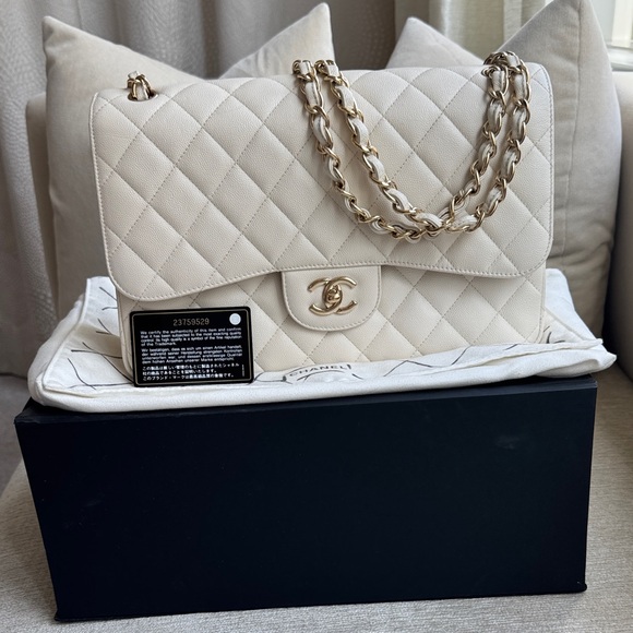 CHANEL Handbags - CHANEL authentic classic flap bag in white with gold hardware, size jumbo